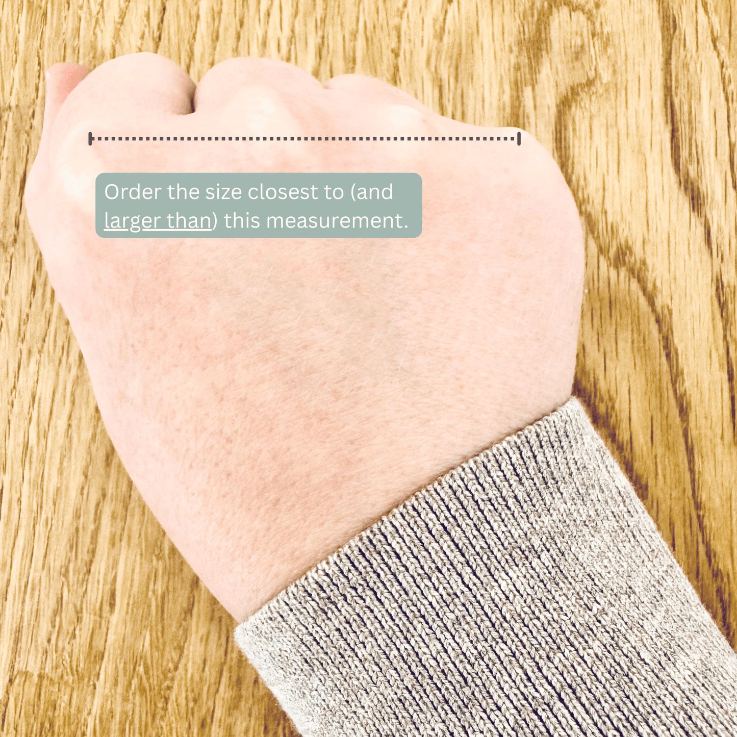 A woman's hand showing the correct measurement to take to determine bangle size.