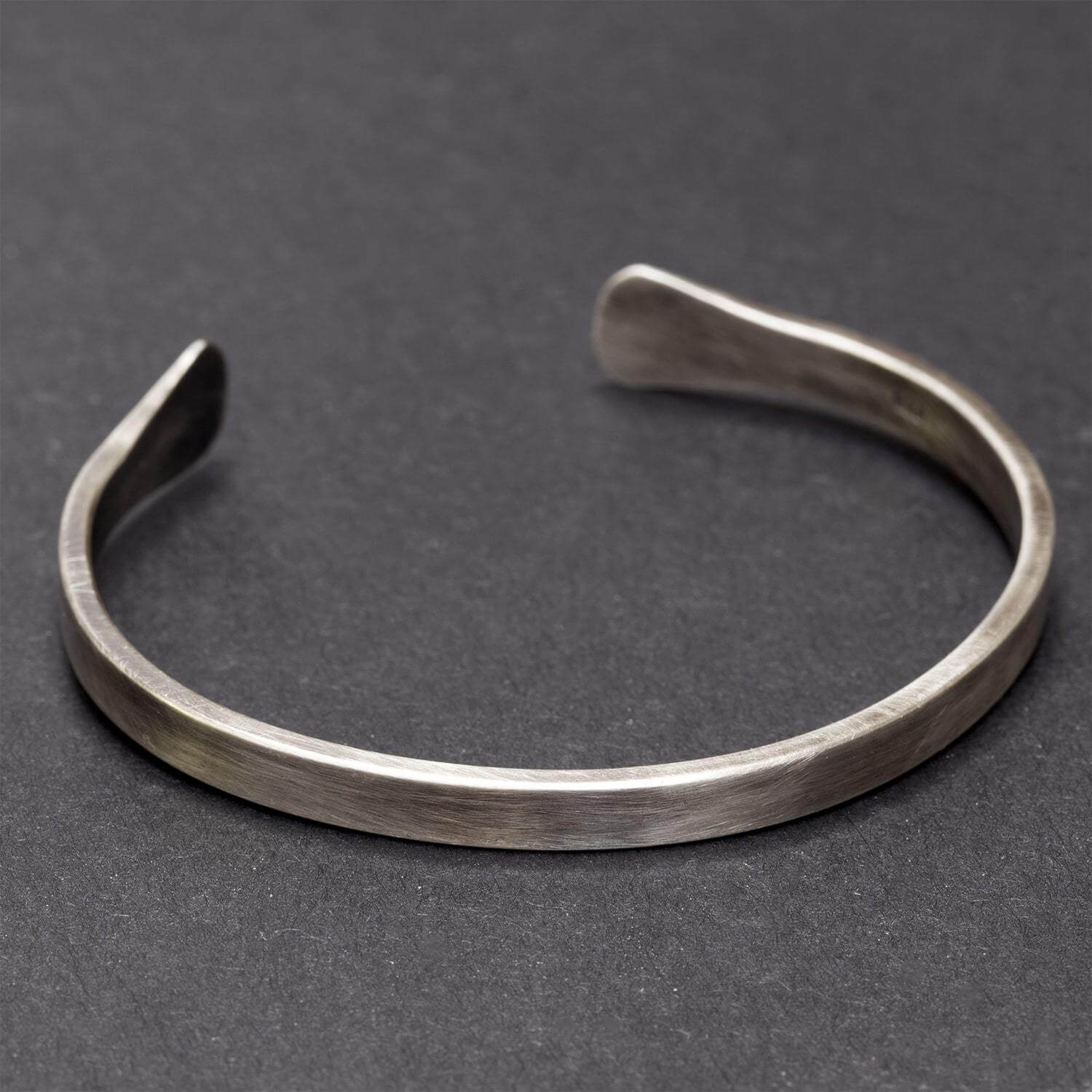 Sterling silver men's cuff bracelet with flared ends and oxidised finish - Rebecca Cordingley