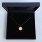 19mm diameter 14k gold coin necklace for women in a black box, handmade by Rebecca Cordingley Jewellery
