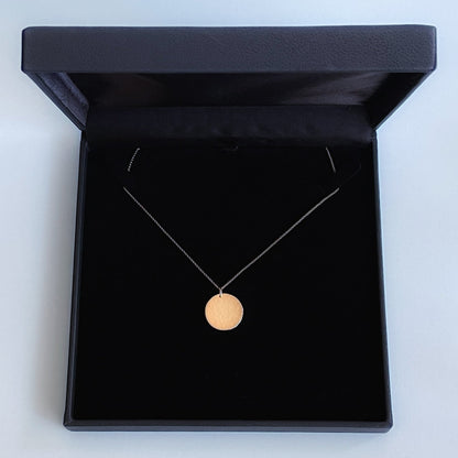 19mm diameter 14k gold coin necklace for women in a black box, handmade by Rebecca Cordingley Jewellery
