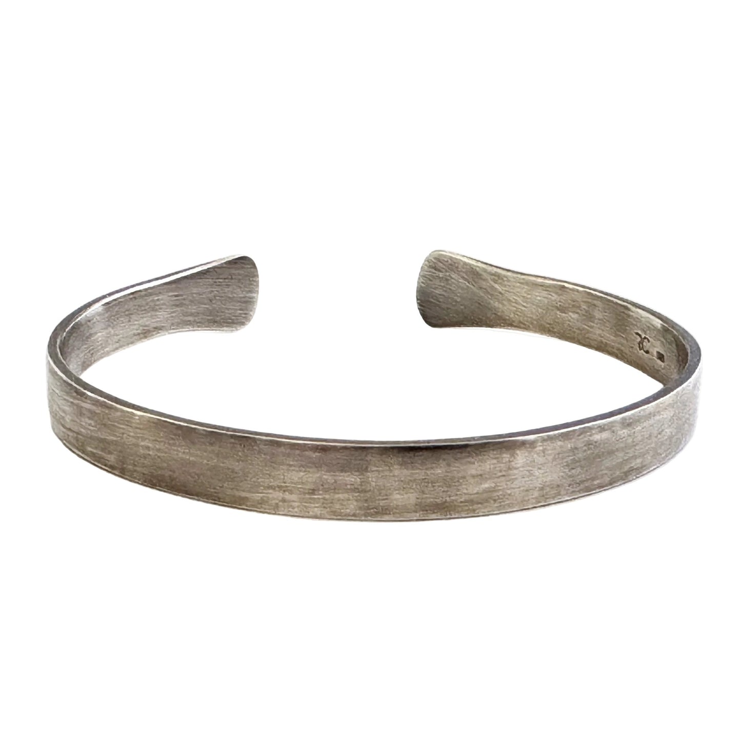 Oxidised sterling silver cuff bracelet on a white background
