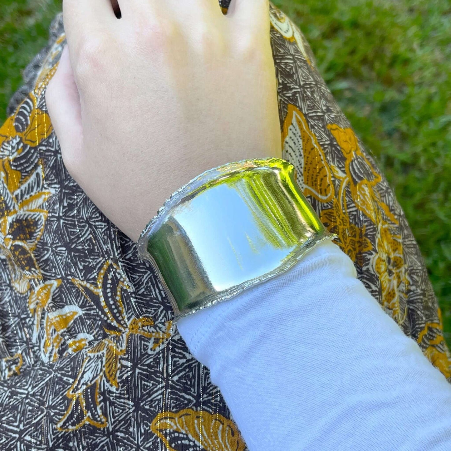 Chunky silver cuff bracelet on a woman's wrist | Rebecca Cordingley Jewellery