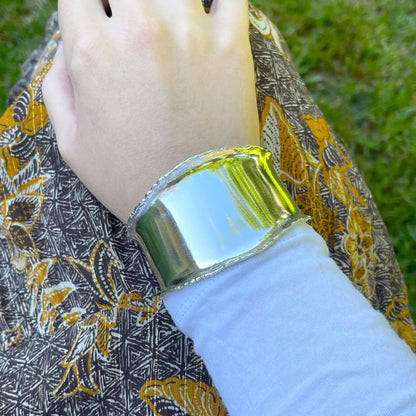 Chunky silver cuff bracelet on a woman's wrist | Rebecca Cordingley Jewellery