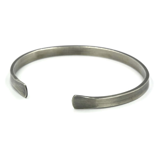 Sterling silver cuff bracelet with flared ends and oxidised finish - Rebecca Cordingley